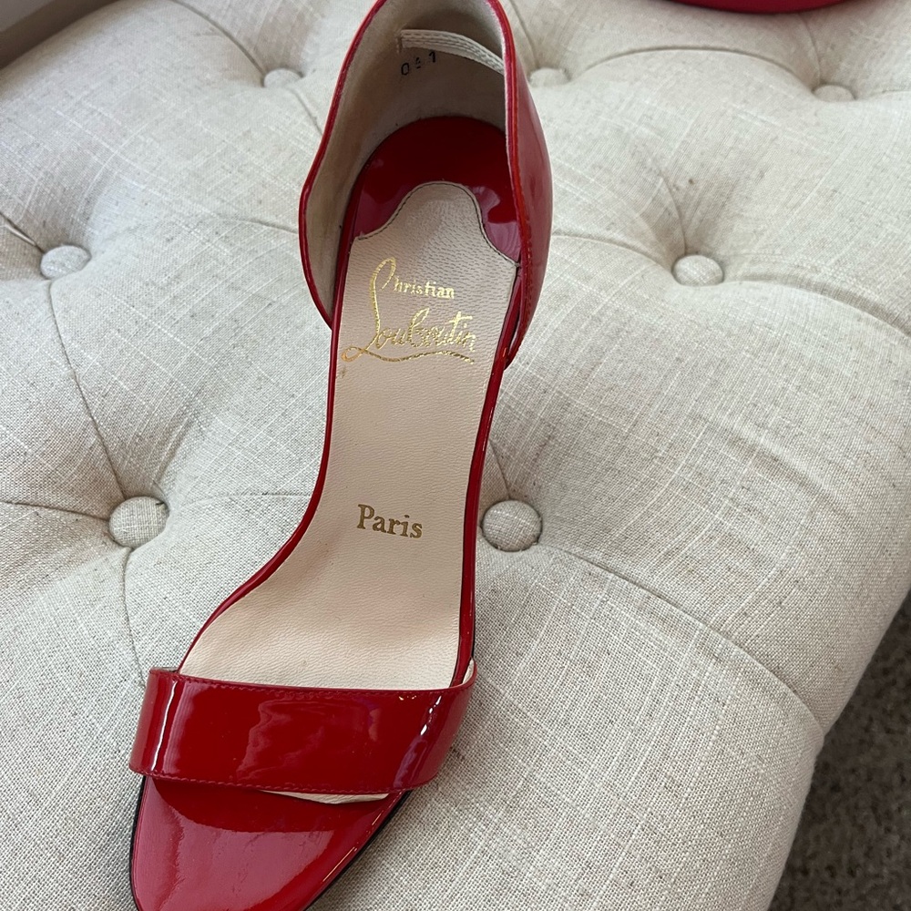 Christian Louboutin red patent leather heel.